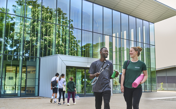 Students walking outside the Sports Centre