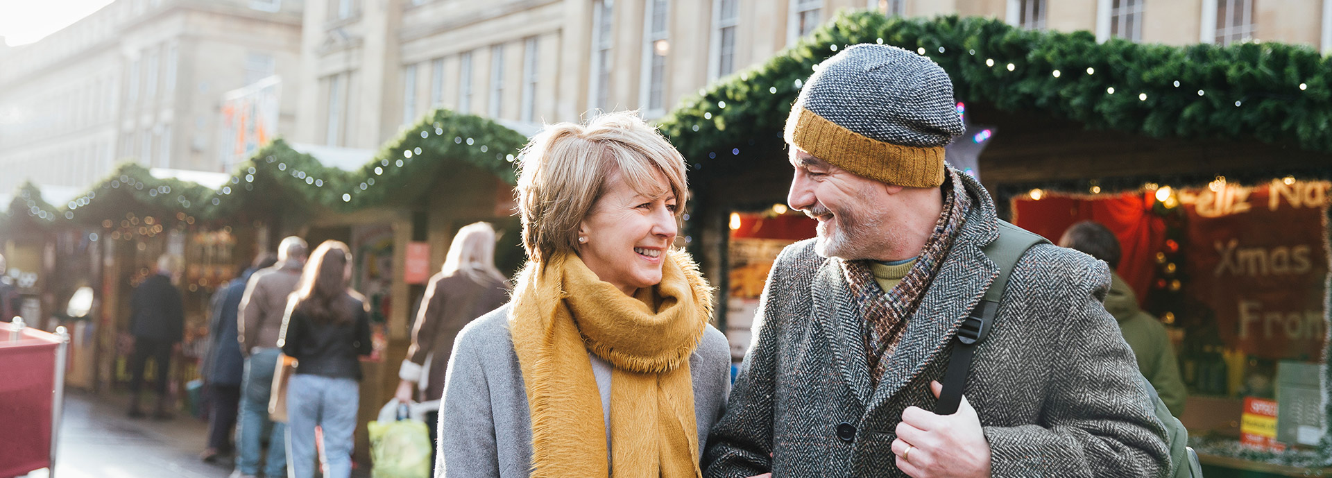 Image of a mature couple at market smiling