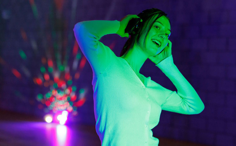 A student dancing in a silent disco