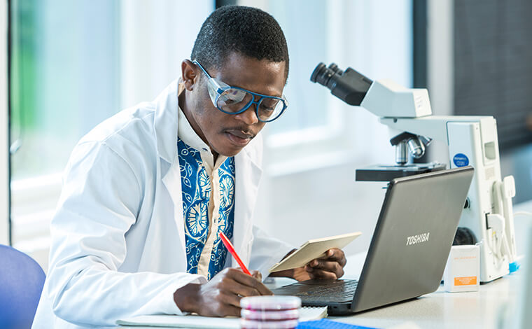 Male student doing research in lab