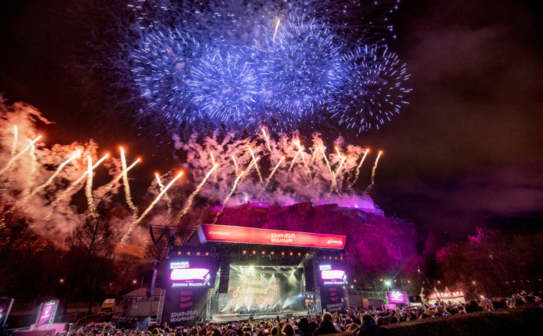 Fireworks bursting over the main stage at Edinburgh's Hogmanay
