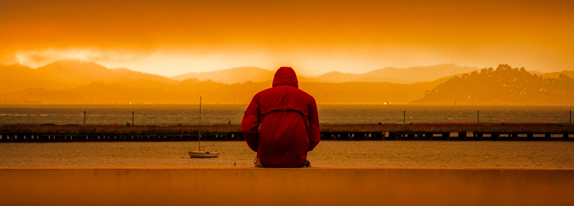 Man sitting at harbour