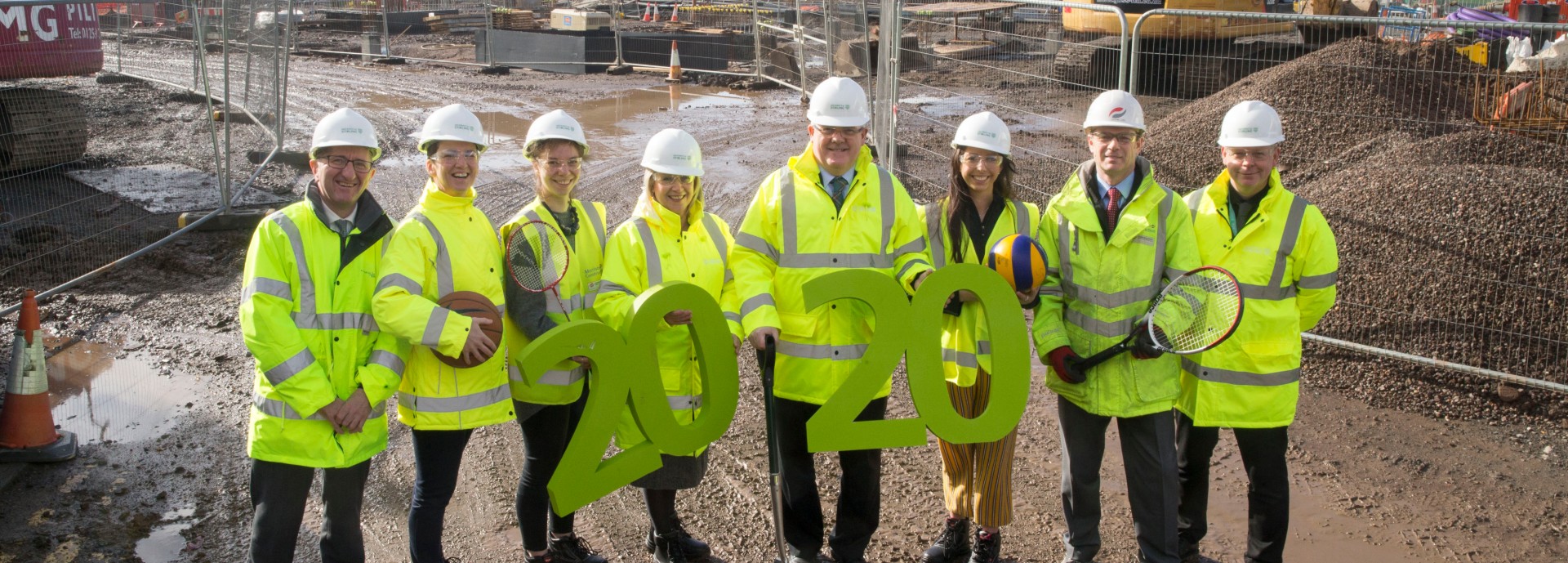 University of Stirling and Morrison Construction representatives on construction site of new sports centre