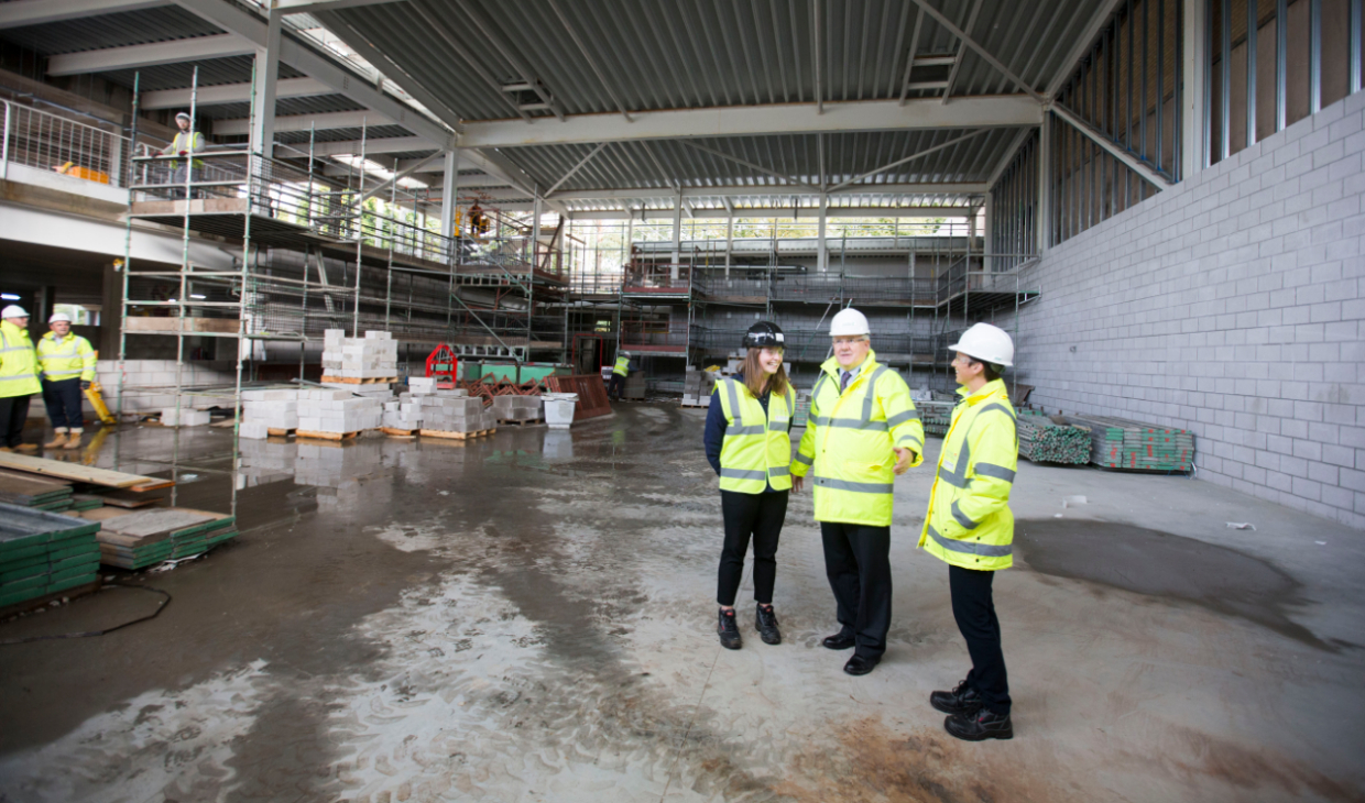 Sports Union President, Gill Thayne, Principal and Vice-Chancellor, Professor Gerry McCormac, and Executive Director of Sport, Cathy Gallagher, in the soon-to-be new three-court sports hall.