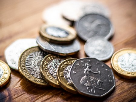 UK coins spread across a table