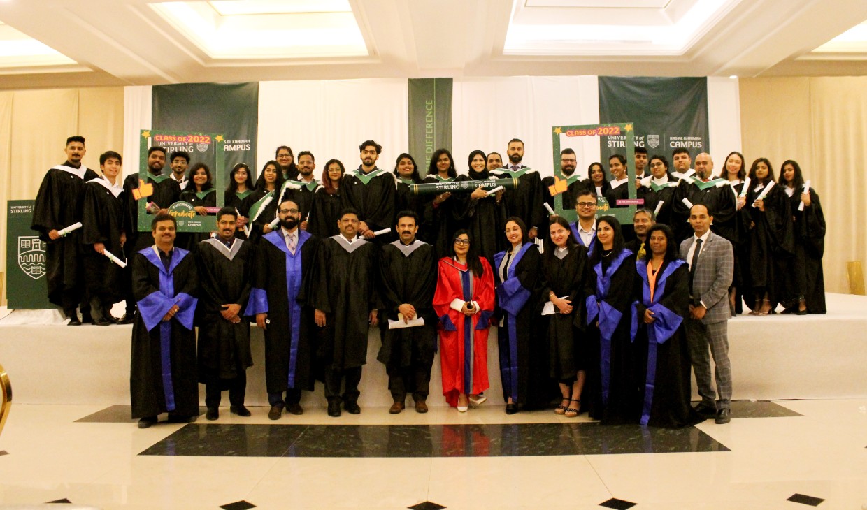 A large group photographer of graduates from RAK, who pose with staff from the UAE and Stirling campuses
