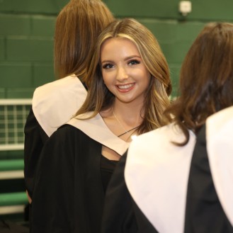 Female graduand in graduation gown