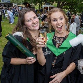 Graduates celebrate at the garden party reception