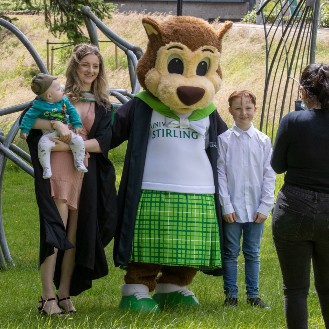 Graduates with squirrel mascot