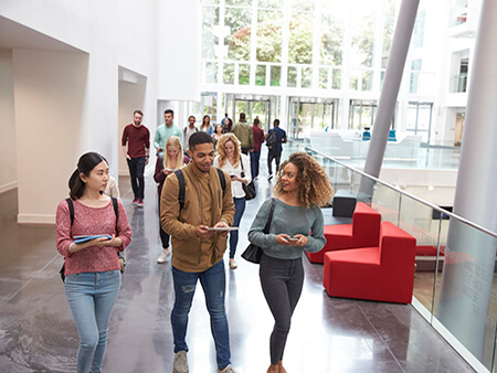 Students walking through a campus building