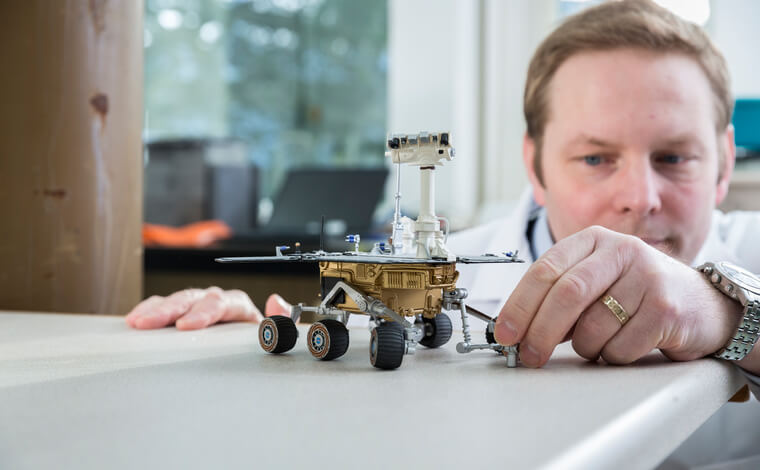 Christian Schroder with Mars rover model