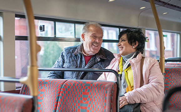 Older people chatting on a bus