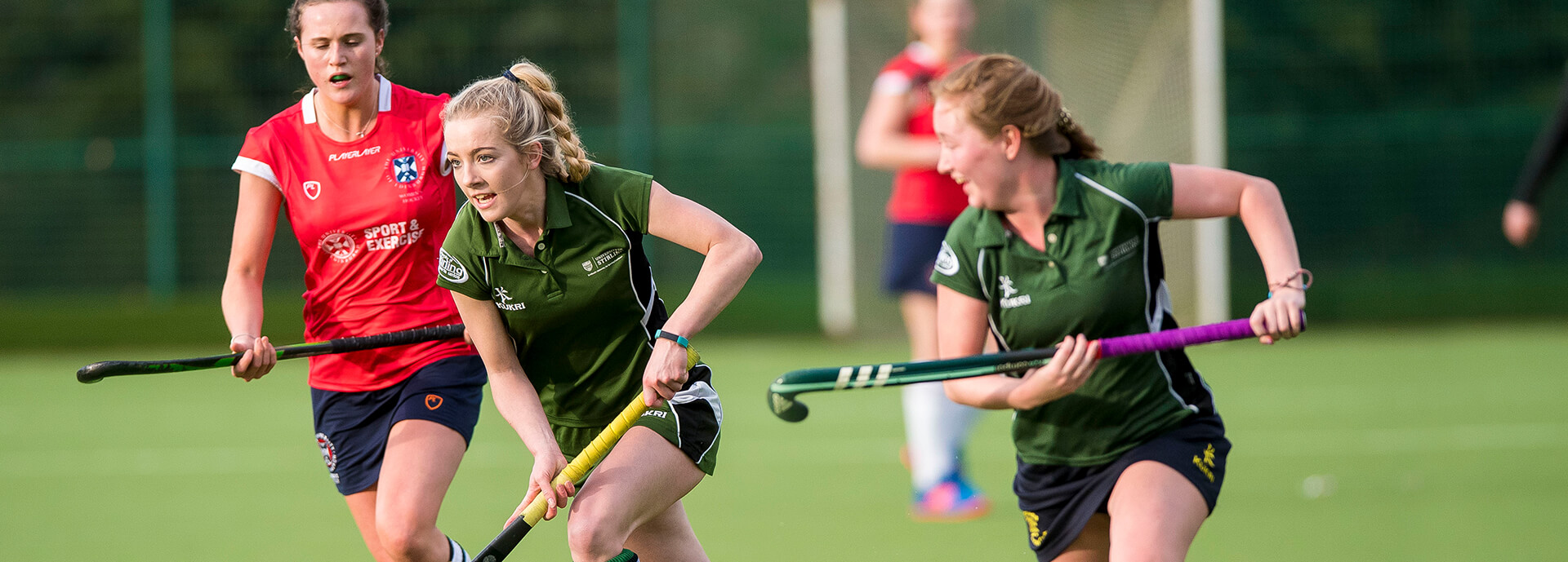 An image of female students playing hockey
