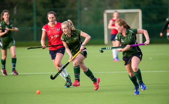 Women's team in action at hockey match