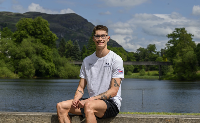 Jack McMillan sitting by the loch.