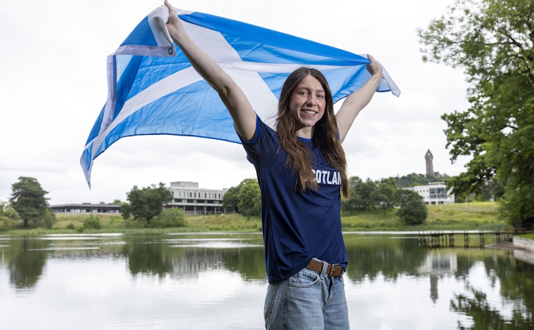 Keanna MacInnes with Scottish flag.