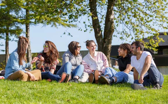 University of Stirling students sitting on the grass