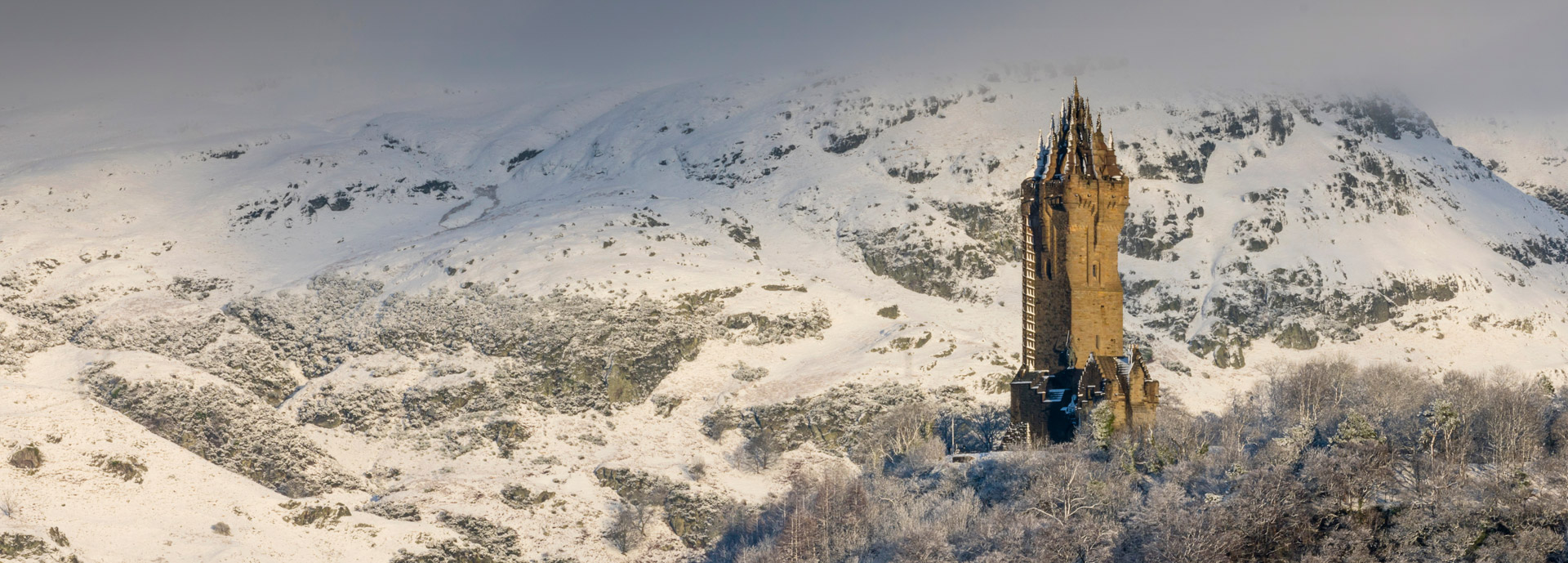 The Wallace Monument on a snowy hilltop