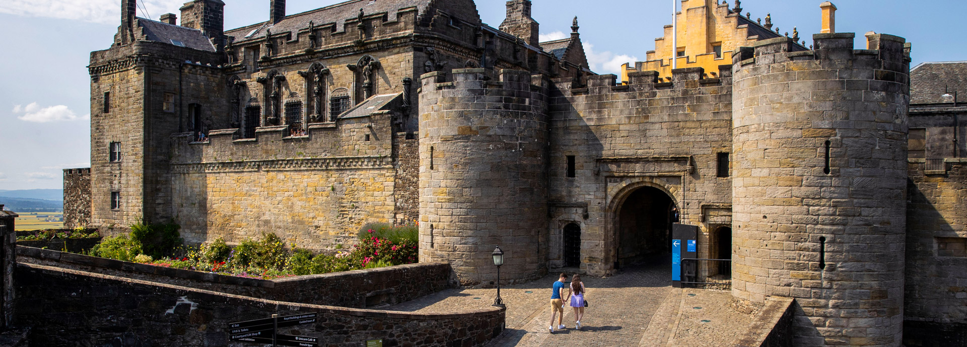 Two students walking into the entrance of Stirling Castle