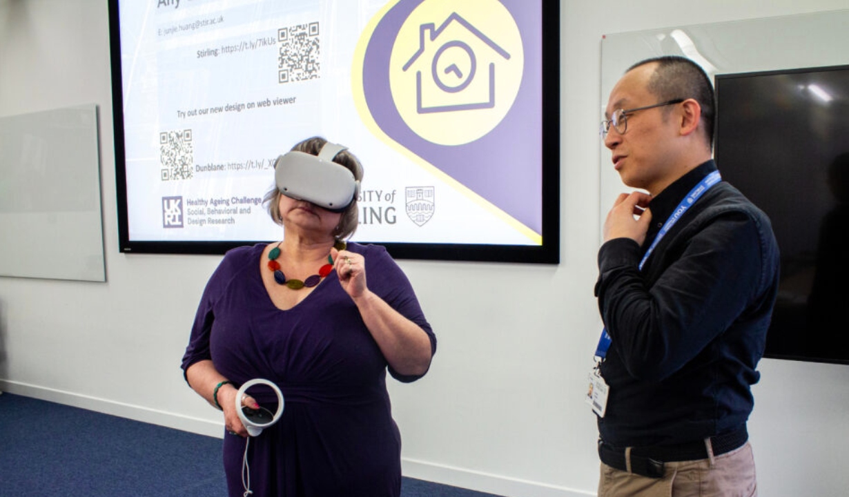 Woman using VR headset and man