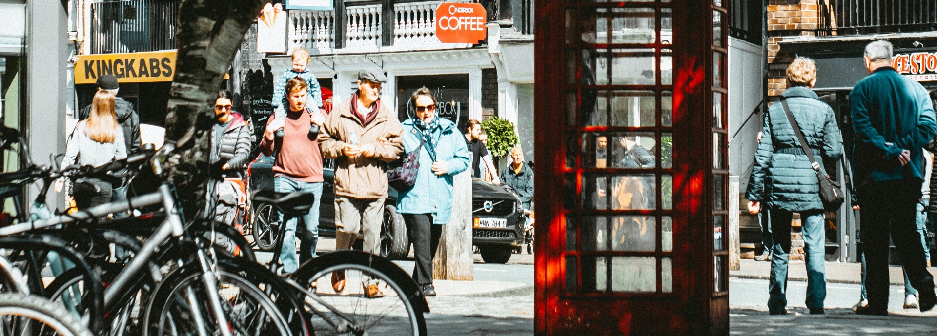 people in street outside shops