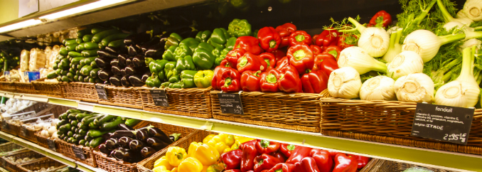 various vegetables in baskets on shelves