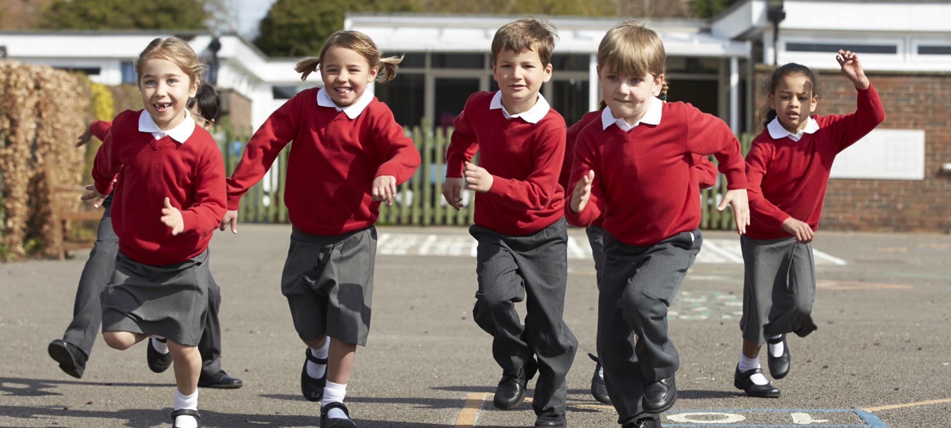 School children running in the playground