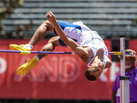 Special Olympics male athlete doing high jump