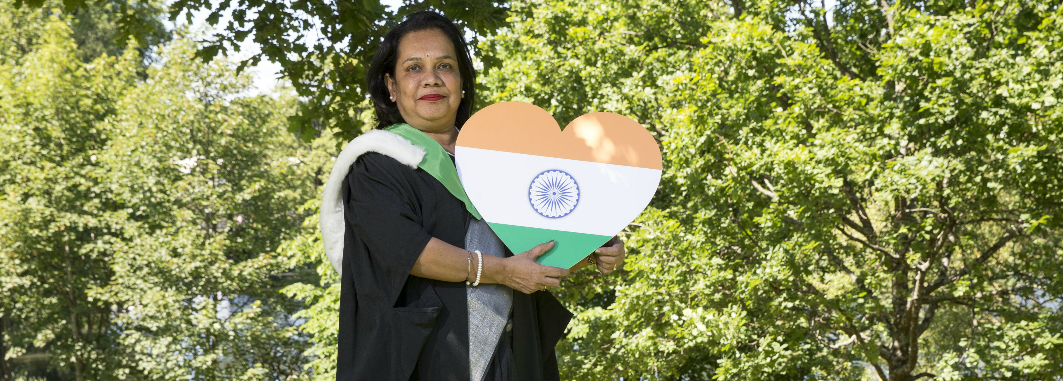 Anupama holding a placard with India flag colours