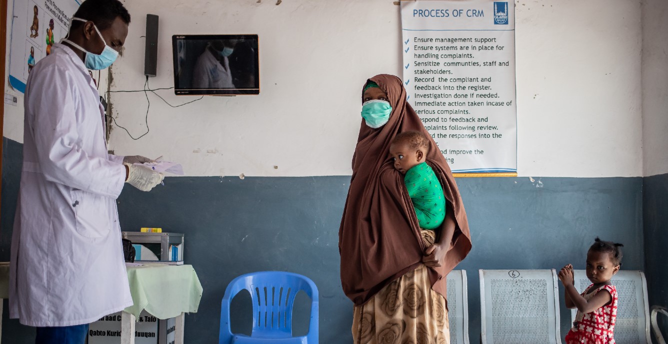 Patients wait in a health clinic in the Bondhere district of Mogadishu. The infrastructure in Somalia is struggling to cope with COVID-19.