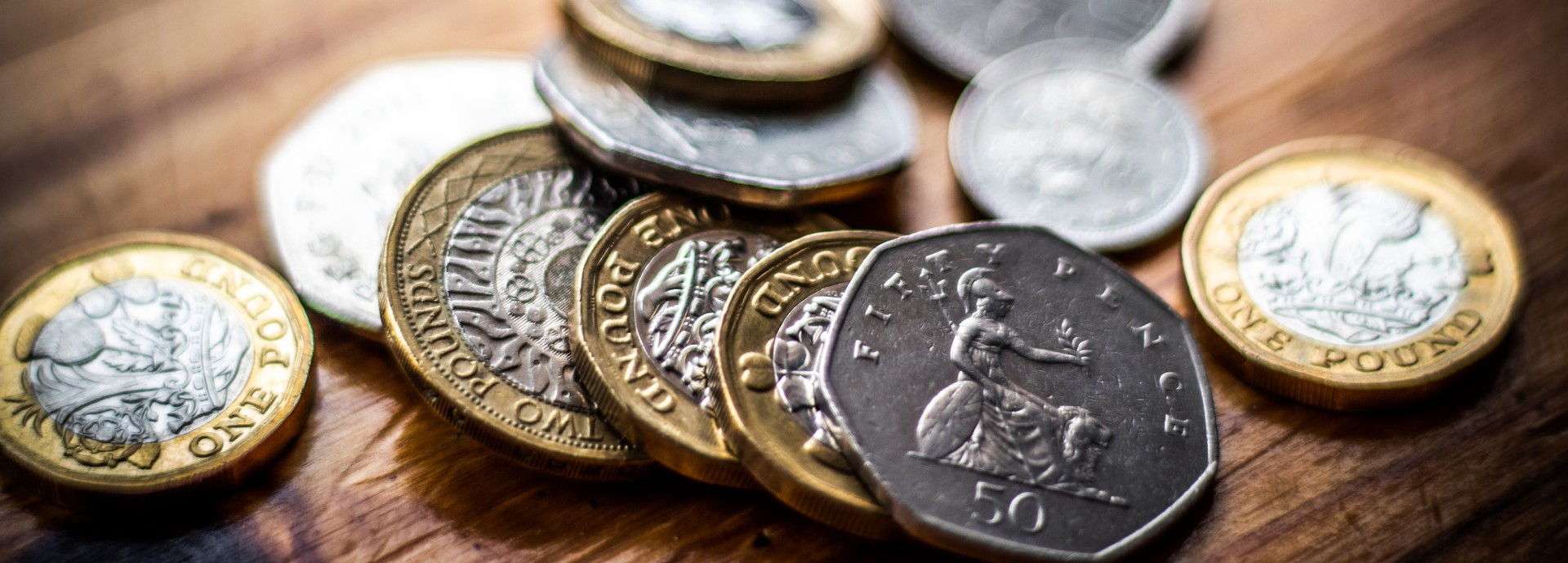 UK coins spread across a table