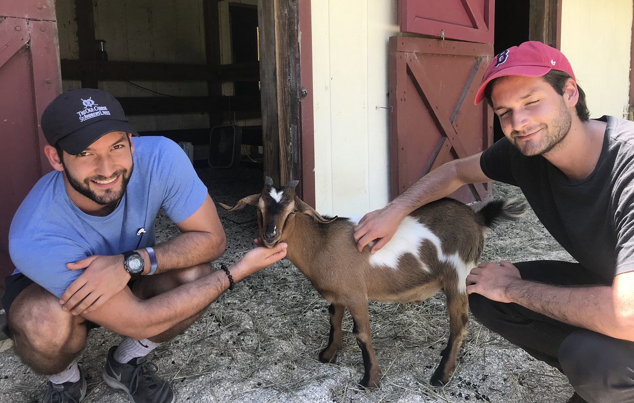 Brian and Charlie Trupo with a goat