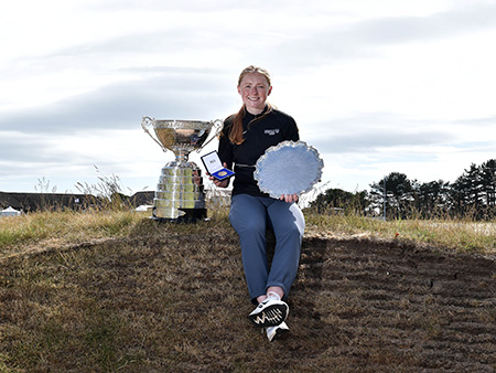 Louise Duncan with golf trophies
