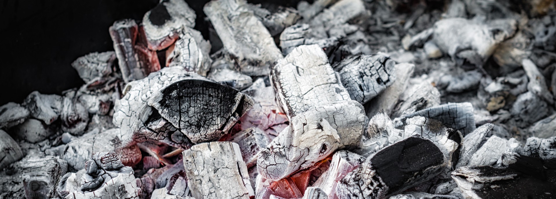 background pattern charcoals smolder on a black background closeup