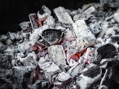 background pattern charcoals smolder on a black background closeup