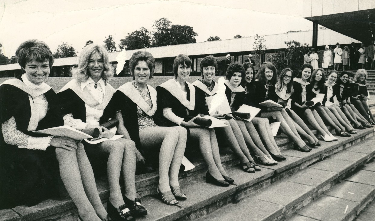 Arts students sit on the steps of Pathfoot at the 1971 graduation