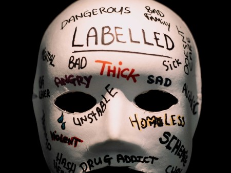 Graffitied mask on display at the exhibition