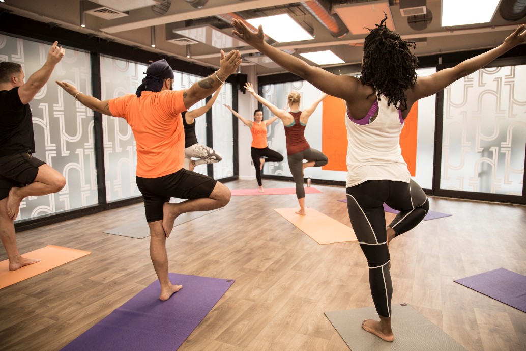 People doing yoga in a studio