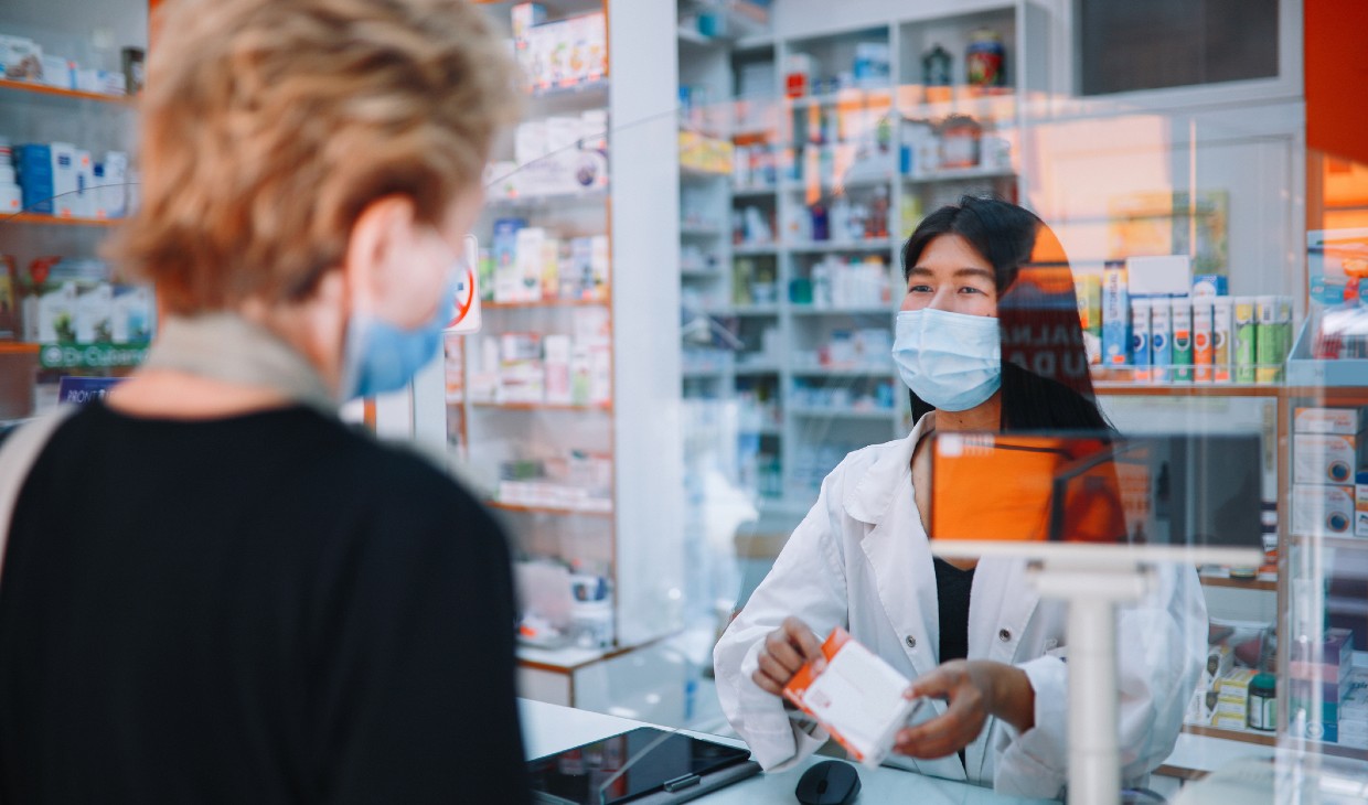 Image of a customer buying medicine during the coronavirus pandemic.