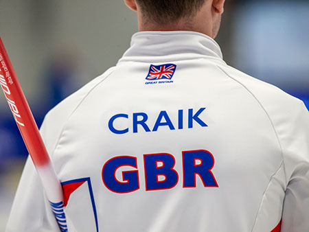 A closeup of the back of James Craik's Team GB jumper during play at the World University Games in Lake Placid.
