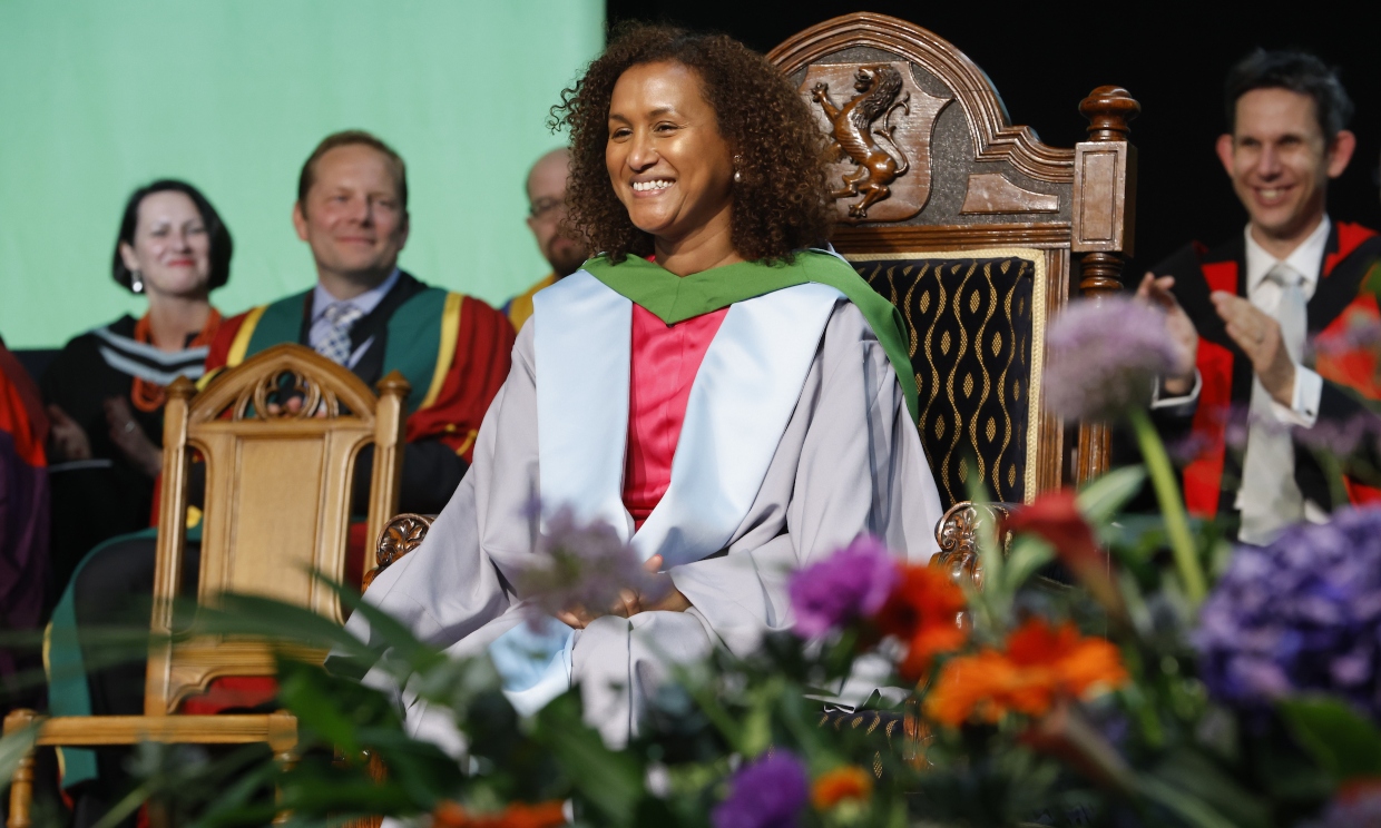 Khadija Coll MBE on stage at graduation ceremony