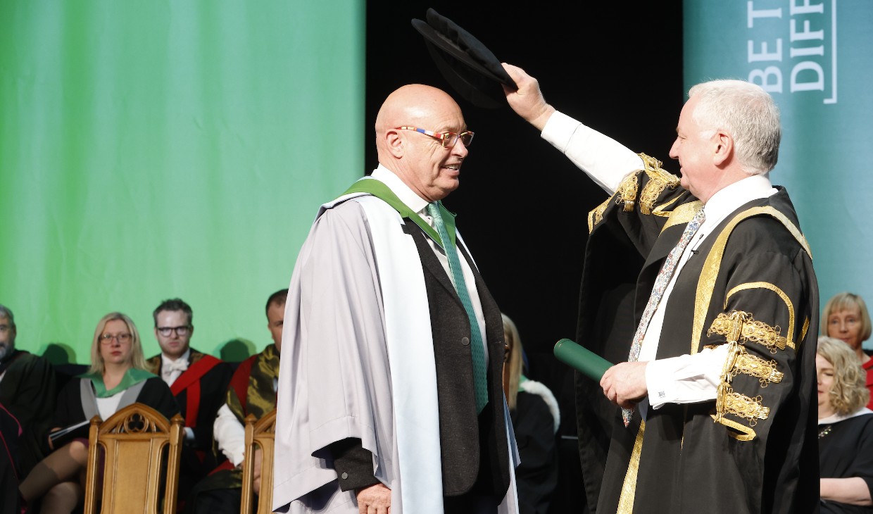 Robert Kilgour receives the customary doff of the cap from the University Chancellor