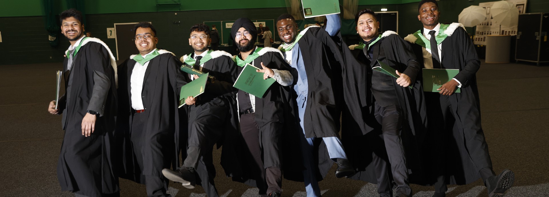 Group of graduates wearing robes ahead of graduation ceremony