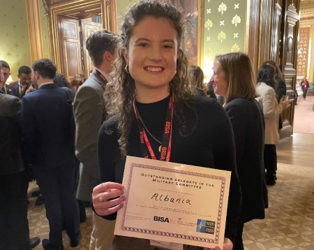 Student Jenna Carty holds her certificate for 'Oustanding Delegate' in the Foreign Office, London following the event.