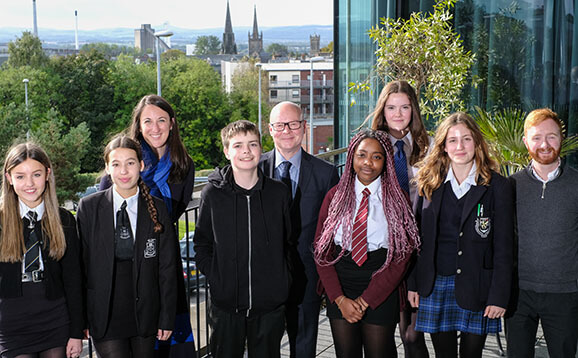 Mix of young school pupils and university staff