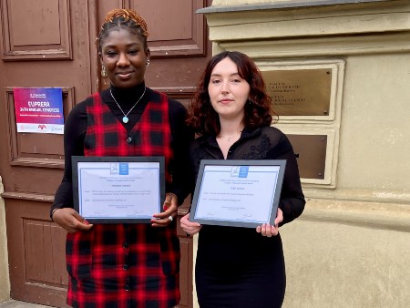 Temi and Caitlin pose with their awards at the Annual Congress in Prague