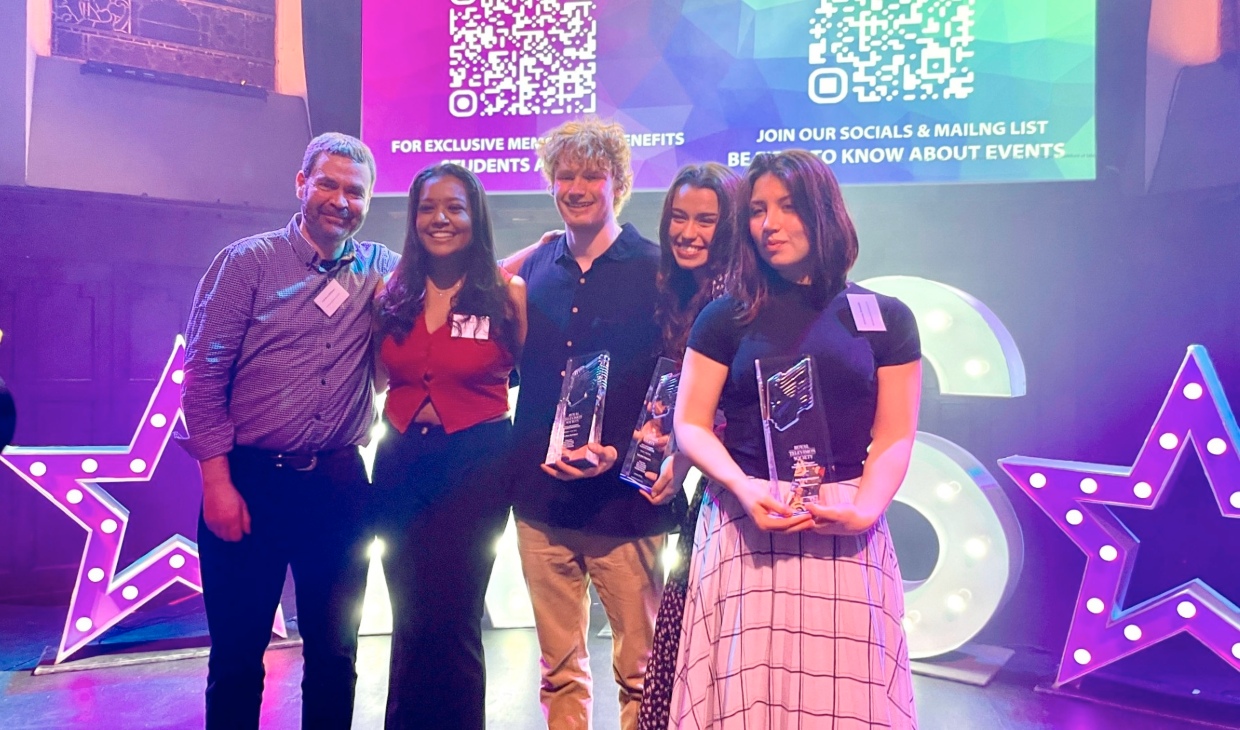 Students and staff accepting award