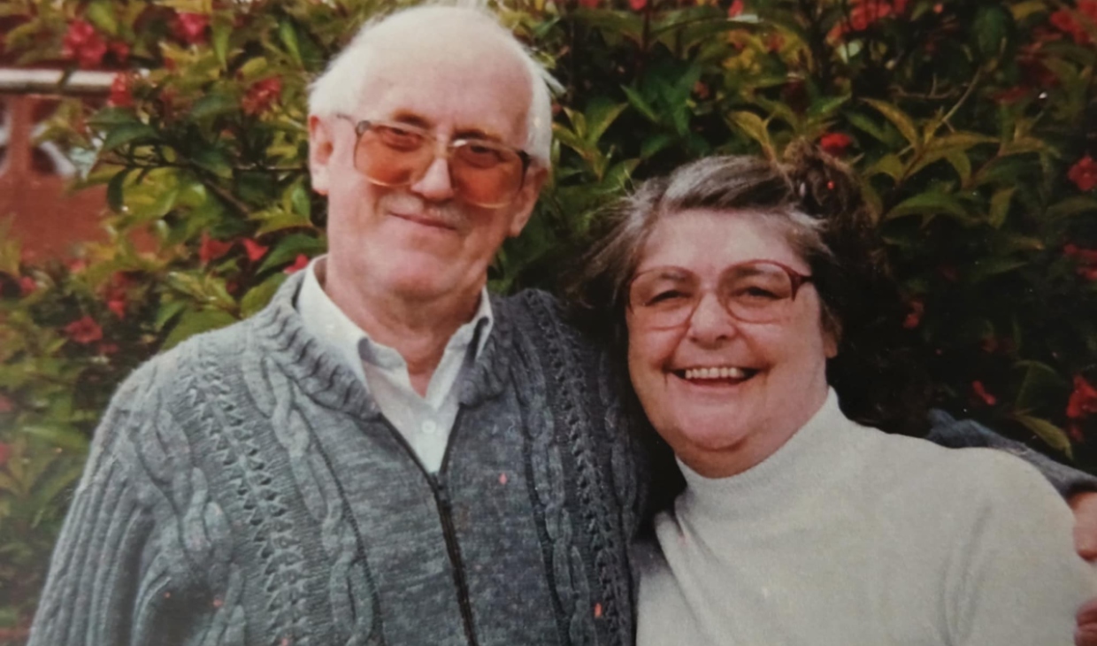 older man and woman smiling