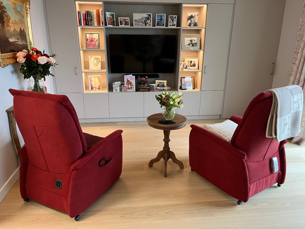 two armchairs in front of TV