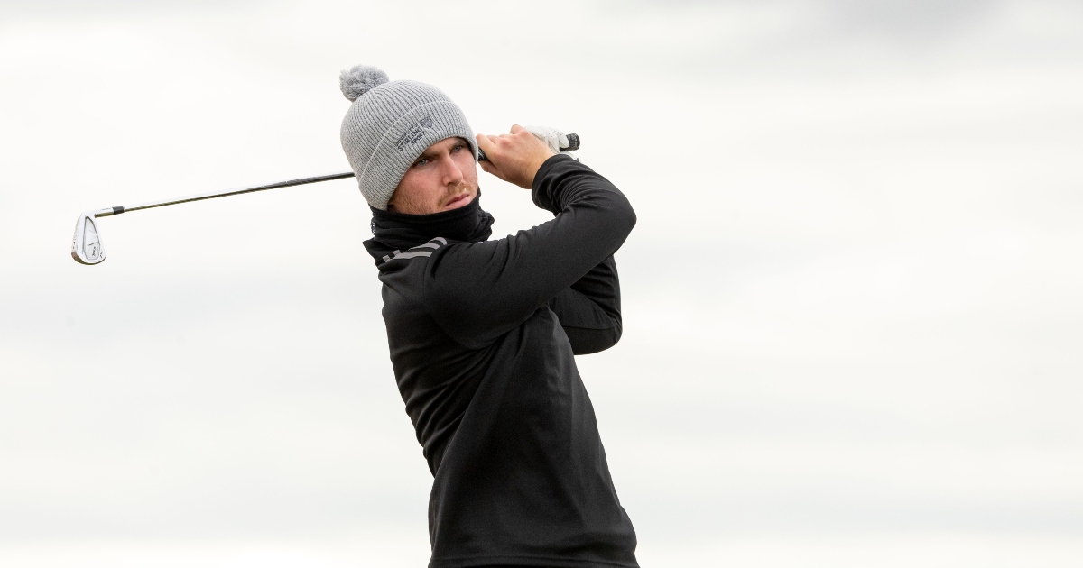 George Cannon hits a golf shot.